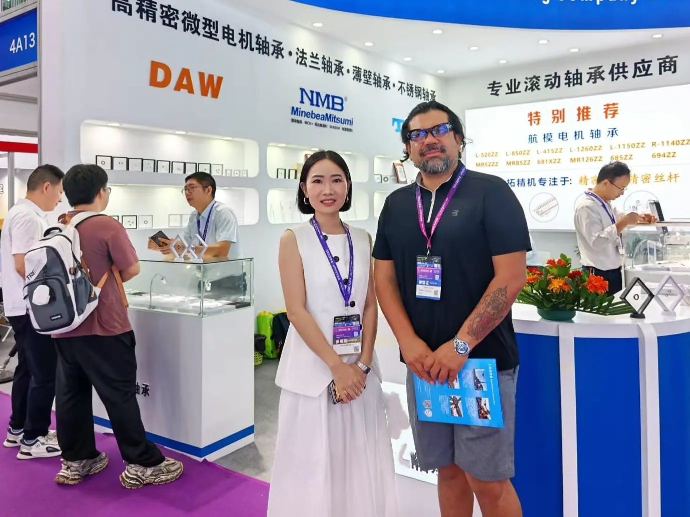 LUMI Bearing representative with an international visitor at a bearing trade show